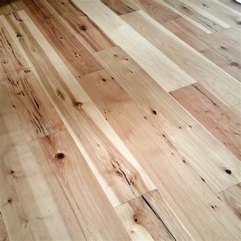 After MUCH deliberation, we decided on a wide plank, hand scraped ...