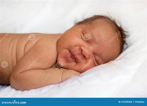 Mulatto Newborn Baby Girl Sleeping. Black Baby on White Bed. Stock ...
