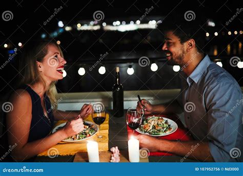 Young Beautiful Couple Having Romantic Dinner on Rooftop Stock Photo ...