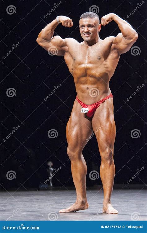 Bodybuilder Shows His Front Double Biceps Pose on Stage Editorial ...
