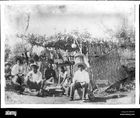 A group of Yaqui Indians at their thatched dwelling, Mexico, ca.1910 ...