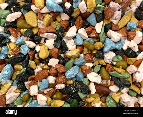 Close up on many colorful chocolate rocks candy coated. Top view Stock ...