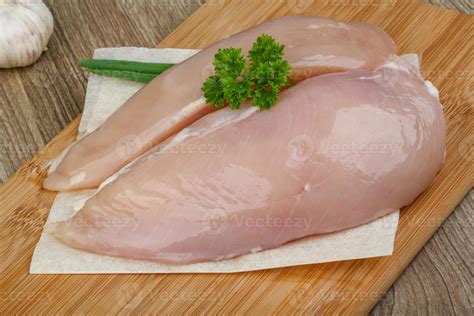 Raw chicken breast 8409361 Stock Photo at Vecteezy