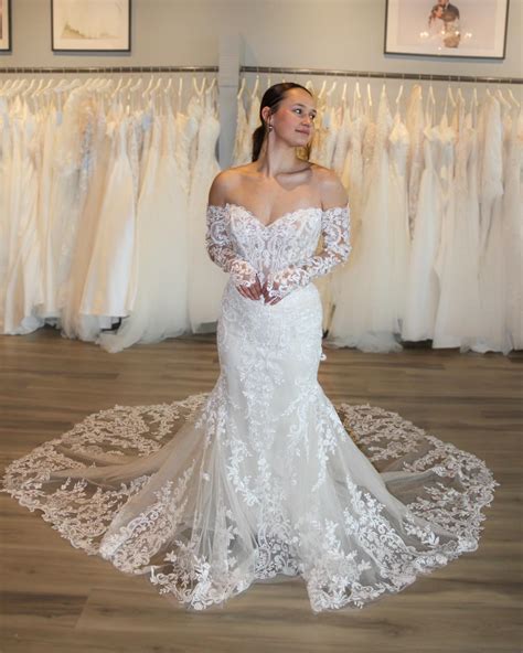 Gracie's Bridal | This fitted gown includes all-over lace with a basque waist and exposed boning ...