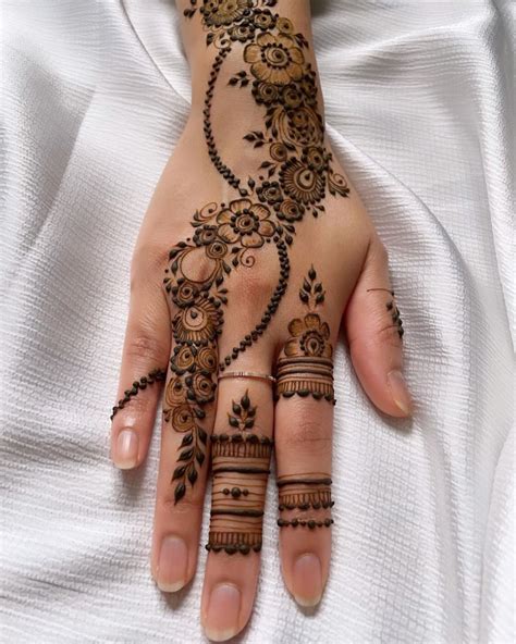 | DAINTY HENNA | By Abida on Instagram: "Floral strip 🌺 • • Design by ...