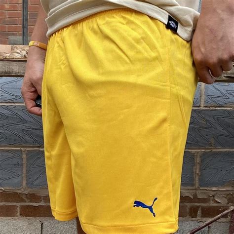 Puma yellow shorts Men’s / women’s yellow deadstock... - Depop