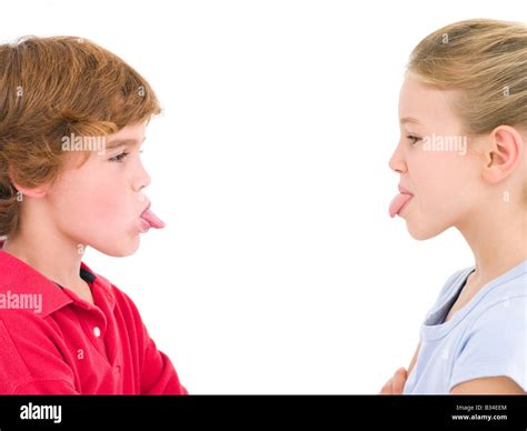 Brother and sister sticking tongues out at each other Stock Photo - Alamy