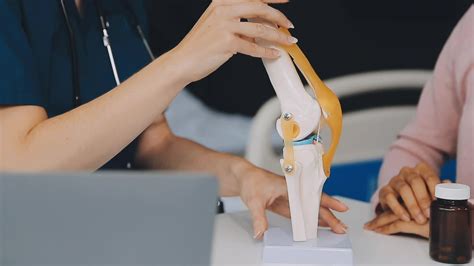 Human cruciate ligament injury treatment concept. Orthopedist showing ...