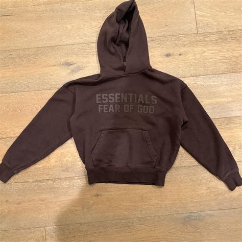 Kids brown essentials fear of god hoodie. Kids size 6 | Depop