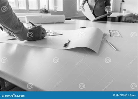 Black and White Image of Architects Measuring and Drafting Plans Stock Image - Image of office ...