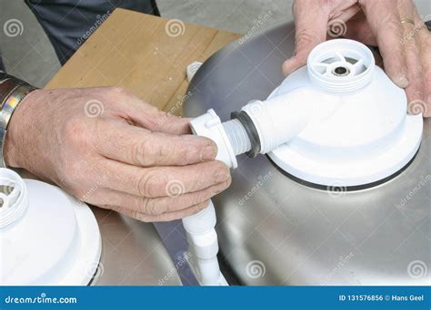 Installing the Drain Pipes of a Kitchen Sink Stock Photo - Image of ...
