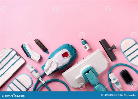 Kit of Modern Professional Steam Cleaners on Pink Background. Top View ...