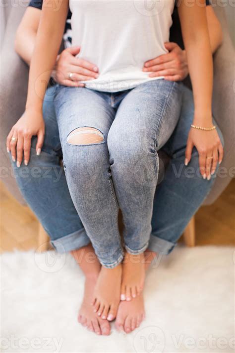 young girl sitting on her boyfriend's lap 17623403 Stock Photo at Vecteezy