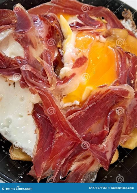 Typical Spanish Dish. French Fries with Fried Egg and Iberian Ham Stock ...