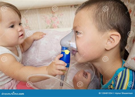 Baby With Nebulizer Mask Stock Photo | CartoonDealer.com #14140800
