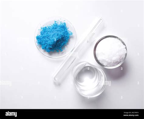 Copper(II) sulfate in Chemical Watch Glass, Crystal clear liquid in beaker and Microcrystalline ...