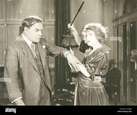 Young woman spanking man hi-res stock photography and images - Alamy