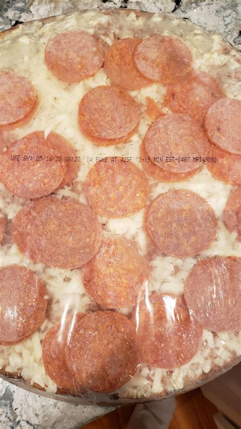 Kirkland frozen pizza has baking instructions on the wrapper of each ...