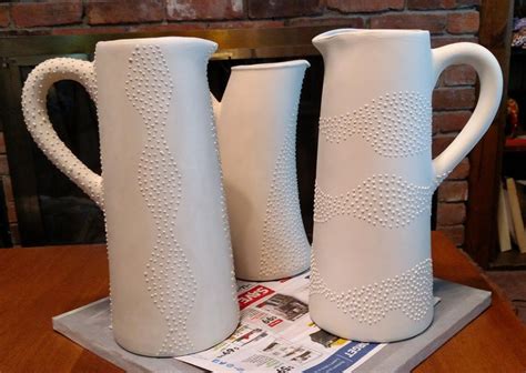 Three pitchers with slip trailed designs | Ceramics, Ceramic pitcher ...