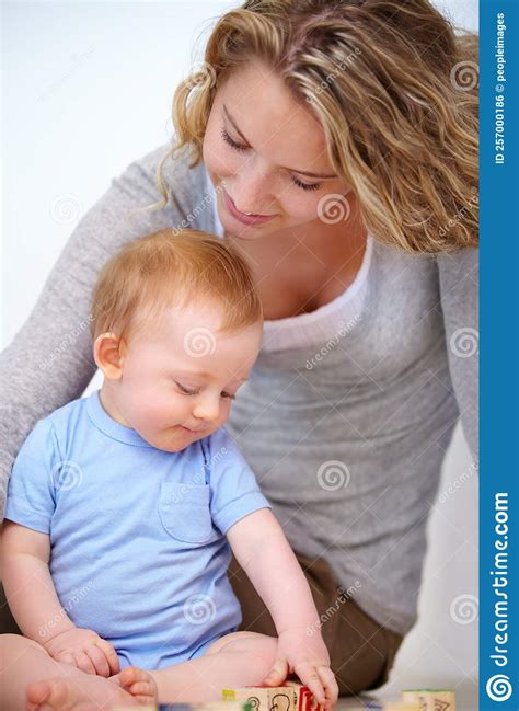 Watching Her Little Man Learn. an Attarctive Young Woman and Her ...