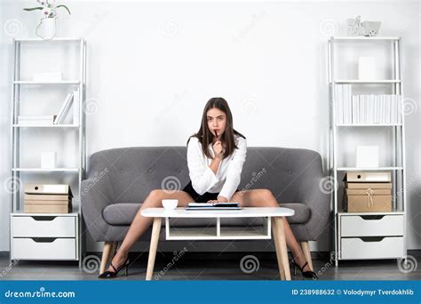 Seductive Secretary with Legs Sit on Sofa in Office. Business Woman ...