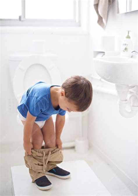 Premium Photo | Child bathroom and toilet training in diaper or ...