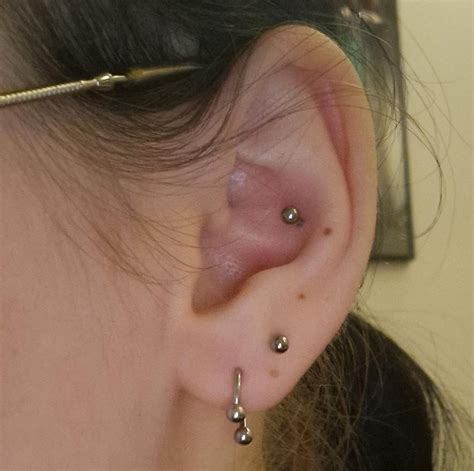 I had my upper lobe and conch pierced on my left ear (2nd image) today ...