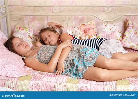 Two Little Girls Sleep In A Bed Stock Image - Image: 33337401