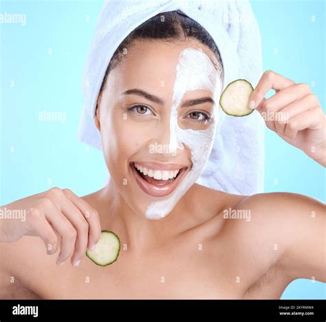 Black woman, cucumber skincare and cream on face to relax eyes, skin ...