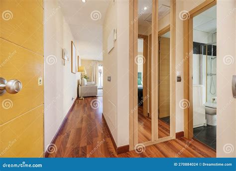 Access Door To a House with a Corridor of Reddish Wood Flooring, a ...