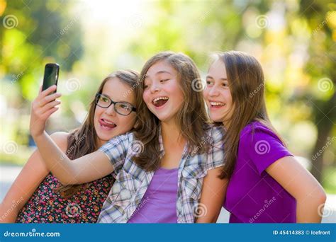 Happy Teen Girls Taking Selfie in Park Stock Image - Image of cellular ...