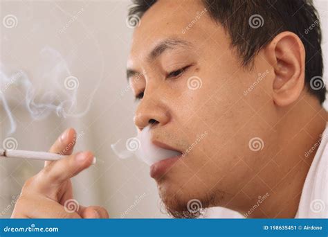 Close Up of a Man Smoking Cigarette, Inhale and Exhaling Smoke from His ...