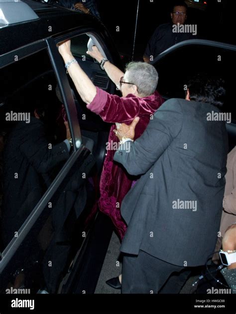 Betty Sue Palmer, mother of Johnny Depp, gets help into a car after ...