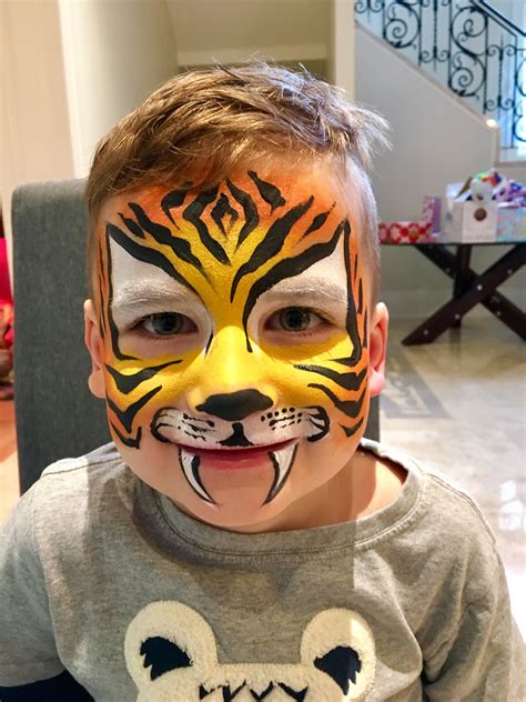 A really cute tiger face painting done from our face painting artist ...