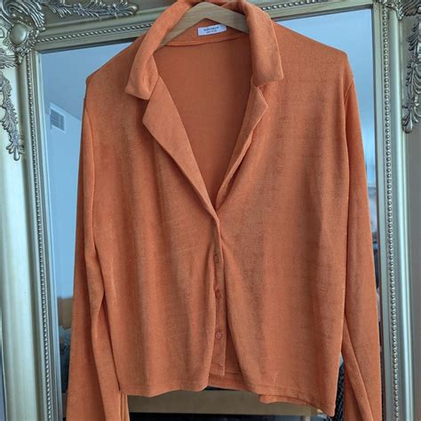 Peppermayo orange button-up shirt. low cut, slightly... | Depop