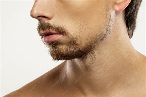 Premium Photo | Closeup of unshaved men's face with a unkempt beard