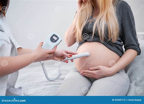 Doctor Diagnosing Pregnant Woman and Listening Heart Beat. Stock Photo - Image of palpitation ...