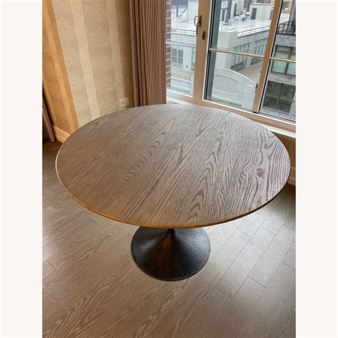 Restoration Hardware Aero Wood Round Dining Table - AptDeco