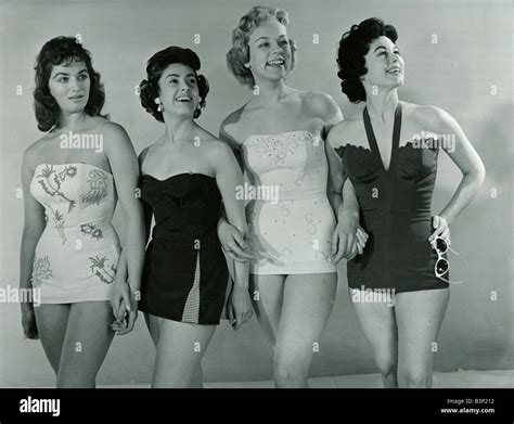 Fashion 1950s Four models wearing swimwear swimming costumes in a ...