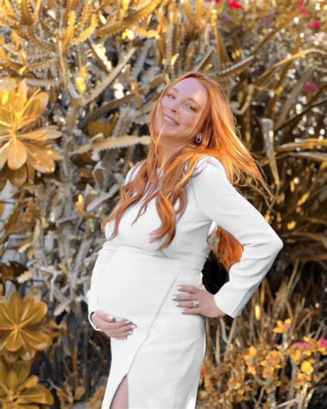 'Hot mama' Lindsay Lohan shows off baby bump in black swimsuit
