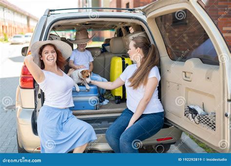 Happy Same-sex Family Going on a Car Trip Around the Country. Lesbian Couple with Son and Dog ...