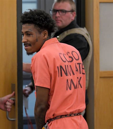 Rapper NBA YoungBoy smirks as he's granted bail & led out of court in ...
