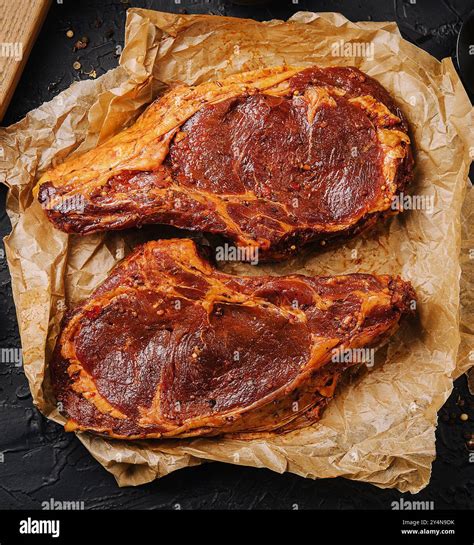 Marinated t bone beef steak top view Stock Photo - Alamy