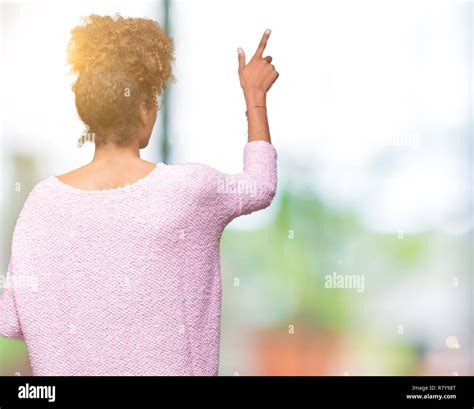 Beautiful young african american woman wearing glasses over isolated ...