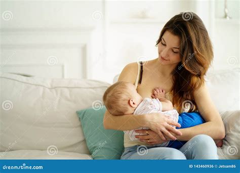 Young Mother Breastfeeding Her Little Son Stock Photo - Image of ...
