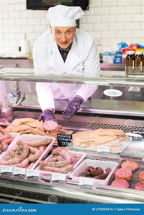 Adult Man Puts Cutlets in Showcase Stock Photo - Image of hispanic ...