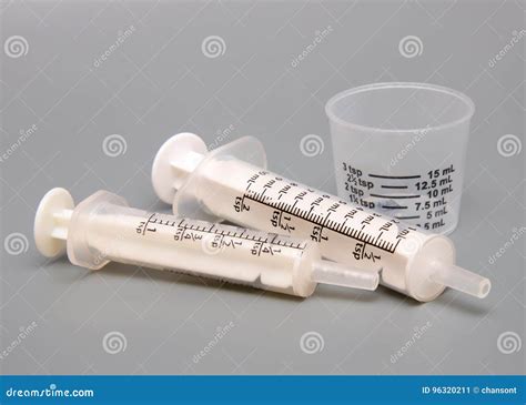 Oral Medicine Syringes and Cup Stock Image - Image of medical, lines ...