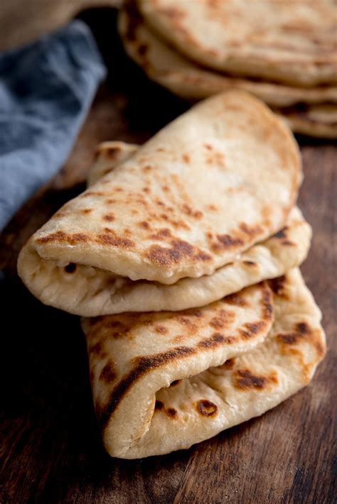 Soft, fluffy Greek Pita style flatbreads that are foldable, even when ...