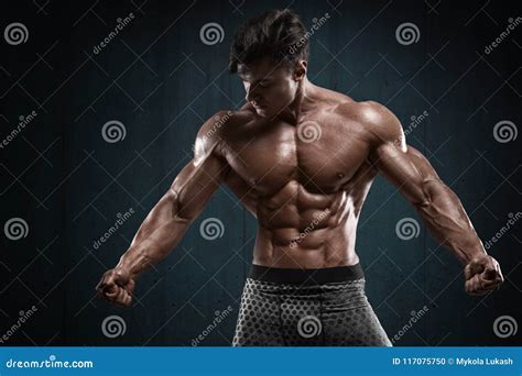 Handsome Muscular Man On Wall Background, Shaped Abdominal. Strong Male ...