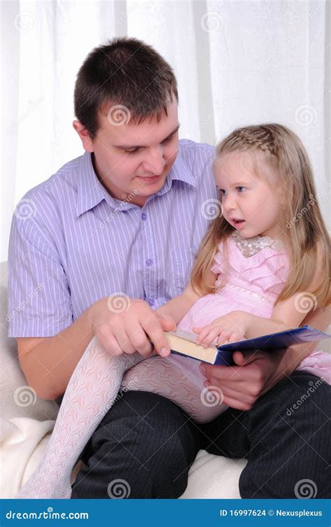 Ittle Girl is Sitting on the Lap of His Father Stock Photo - Image of ...